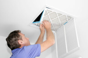 technician inspecting and providing Air Purification & Air Vent Cleaning for Palm Beach, FL