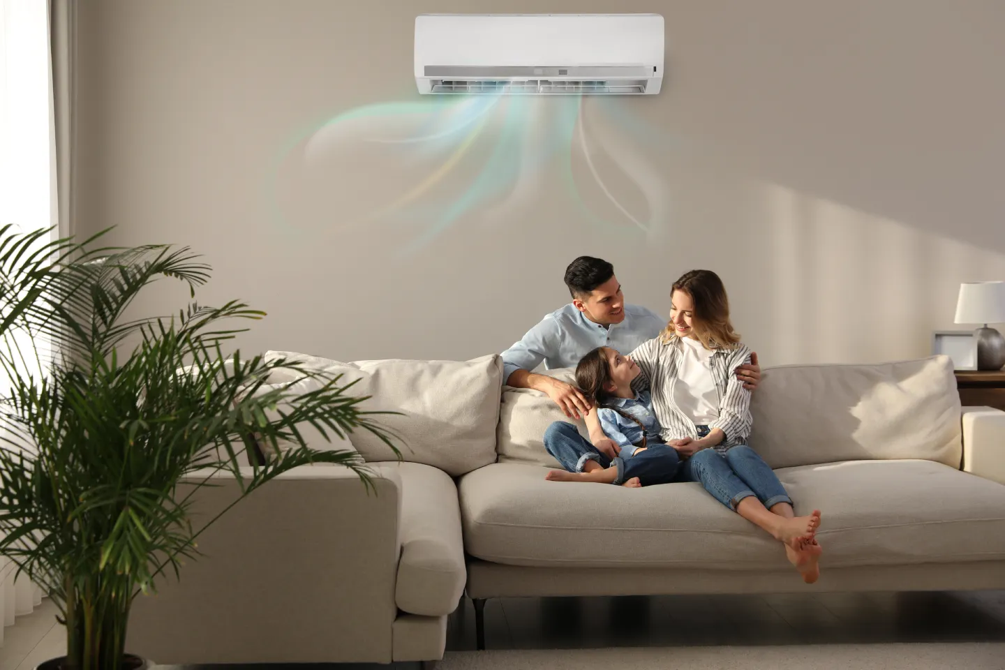 happy-family-resting-air-conditioner-beige-wall-home
